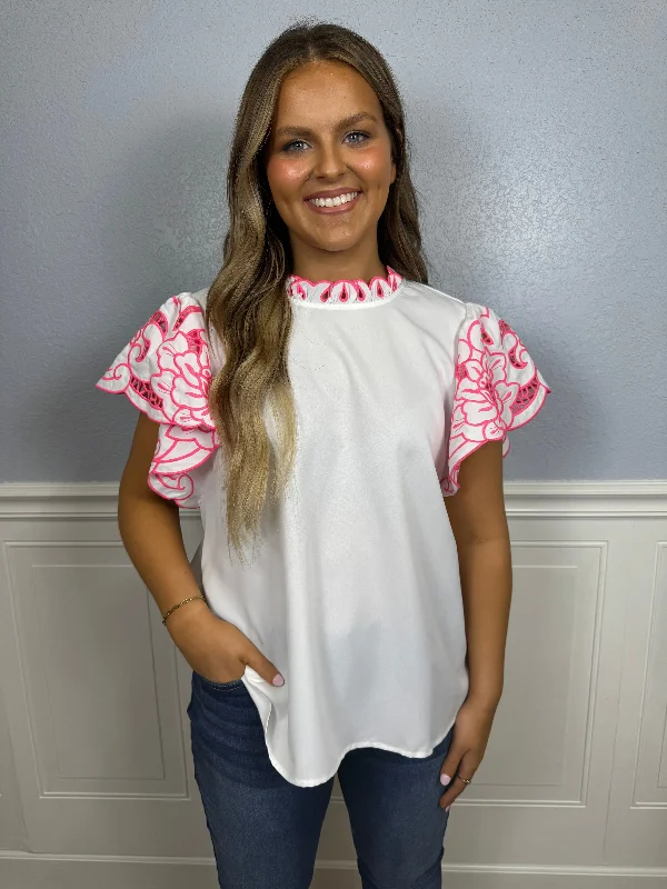 White mock neck top with floral eyelet sleeves